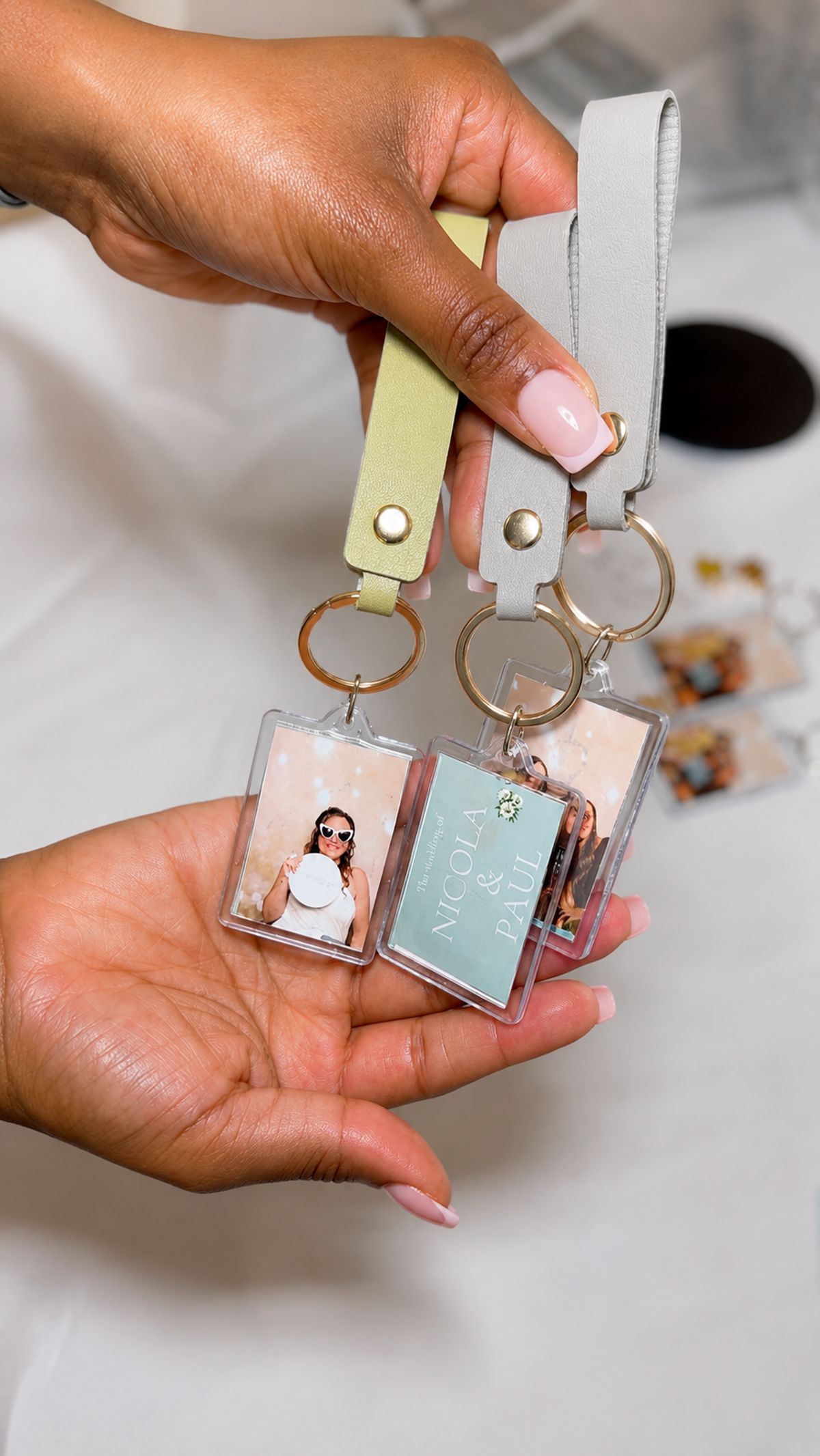 Finished personalised keyrings held in hand