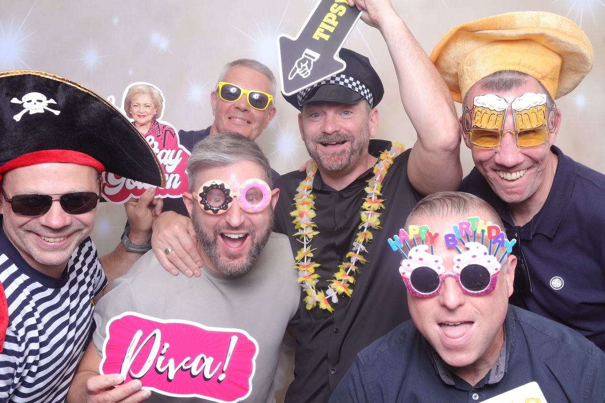 Guests laughing with props at a private party